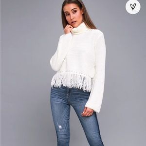 Turtle neck, fringe, flared sleeve sweater
